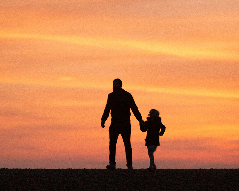Parent and child in silhouette